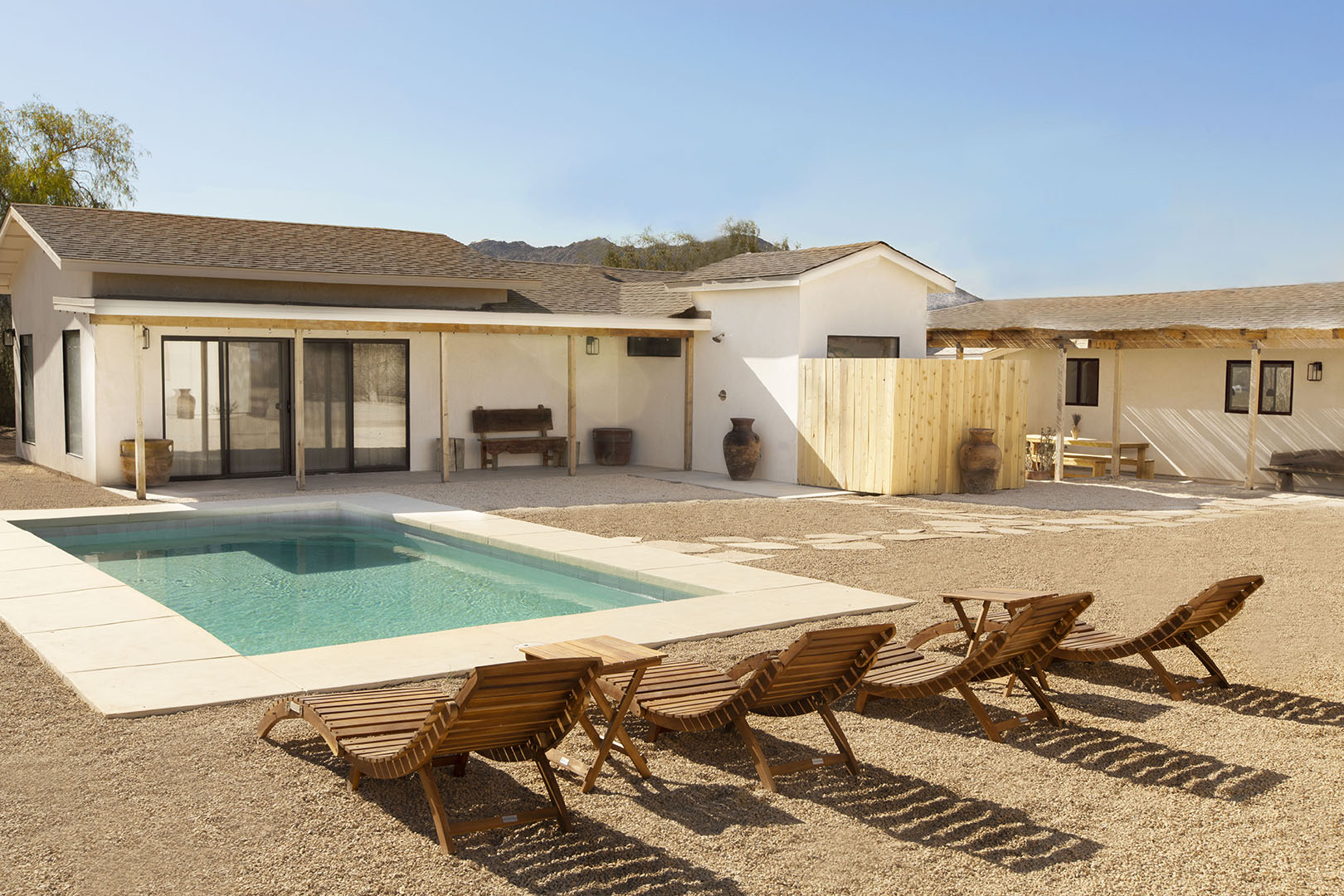 chairs facing pool