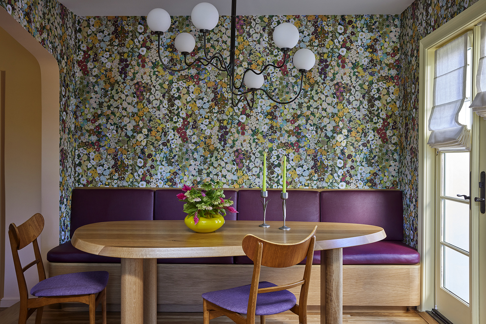 Dining room view of floral wallpaper and dining table