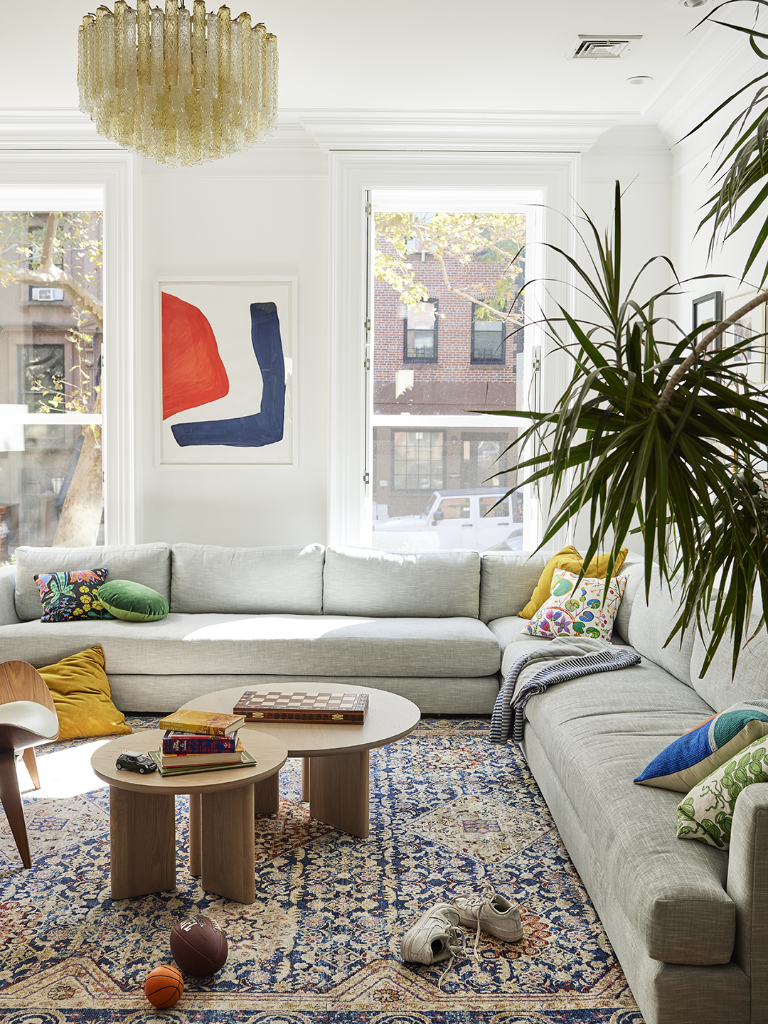 L-shaped sofa in living room with natural light