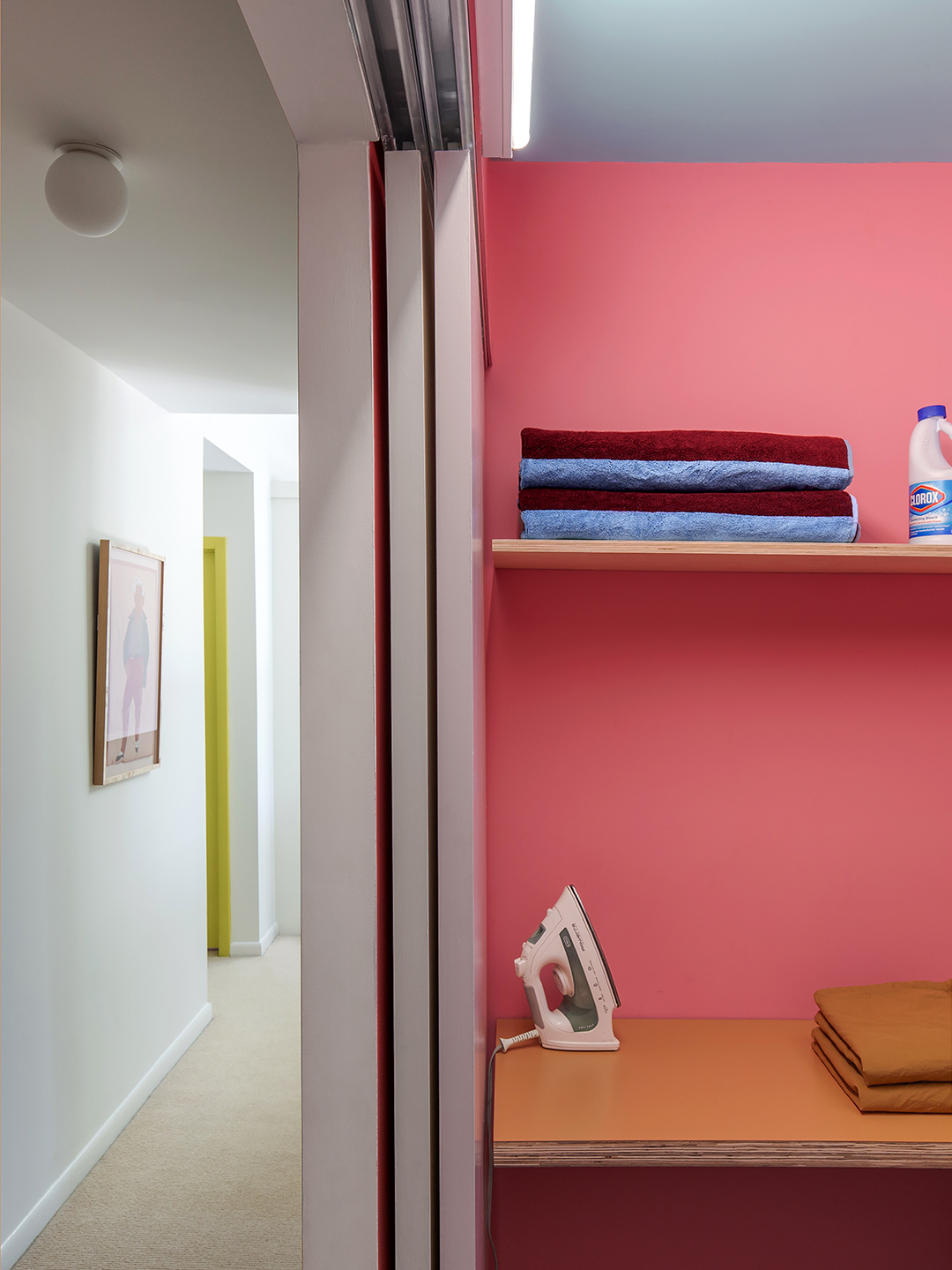 Pink laundry room wall