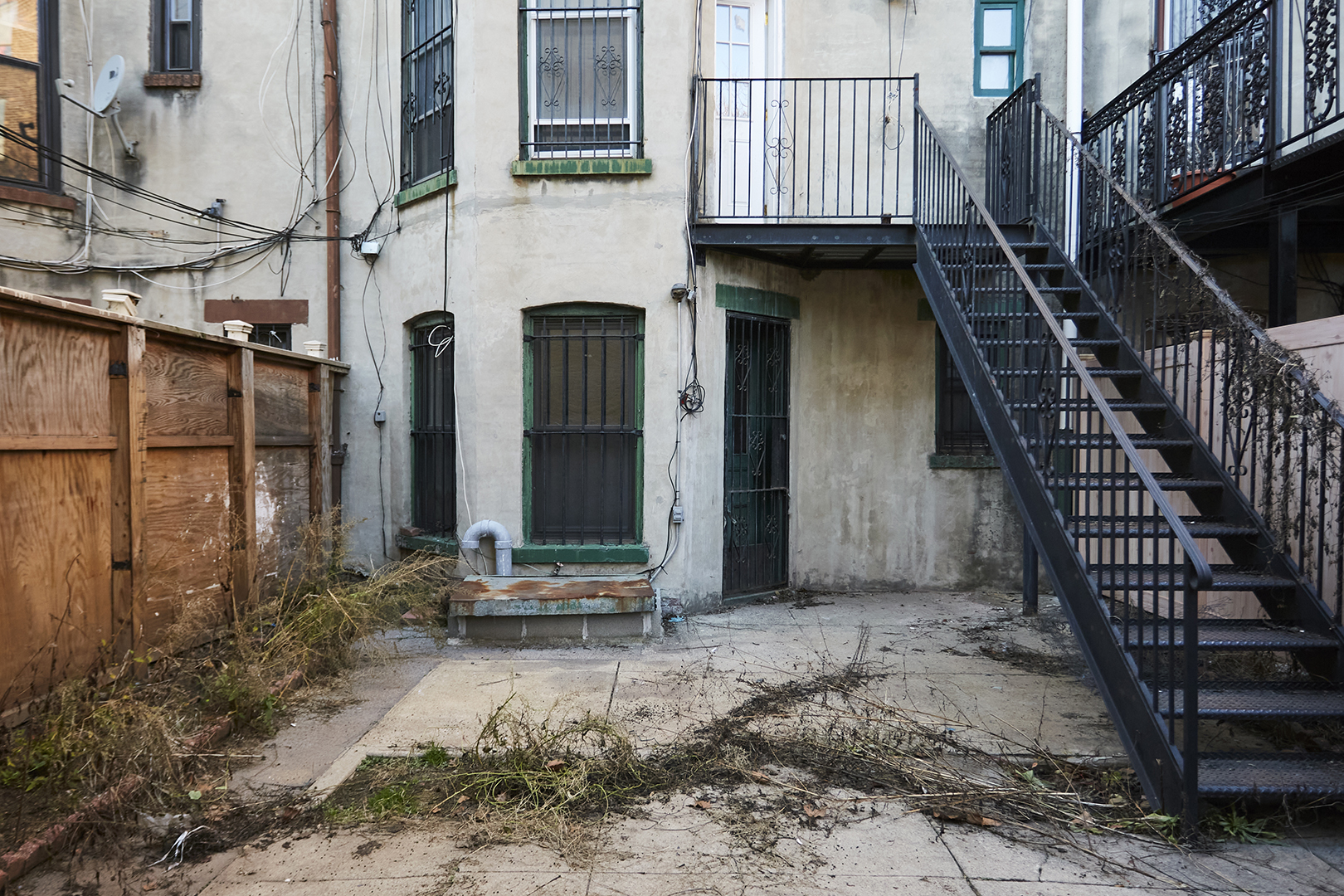 backyard with dirt and debris