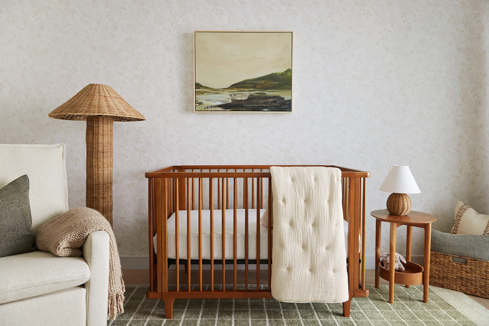 Crib next to rattan floor lamp