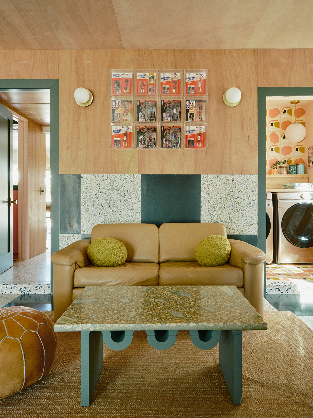 Sofa and table in front of a plywood wall