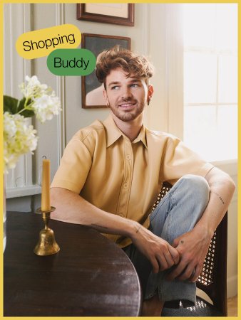 Man in yellow shirt sitting on chair