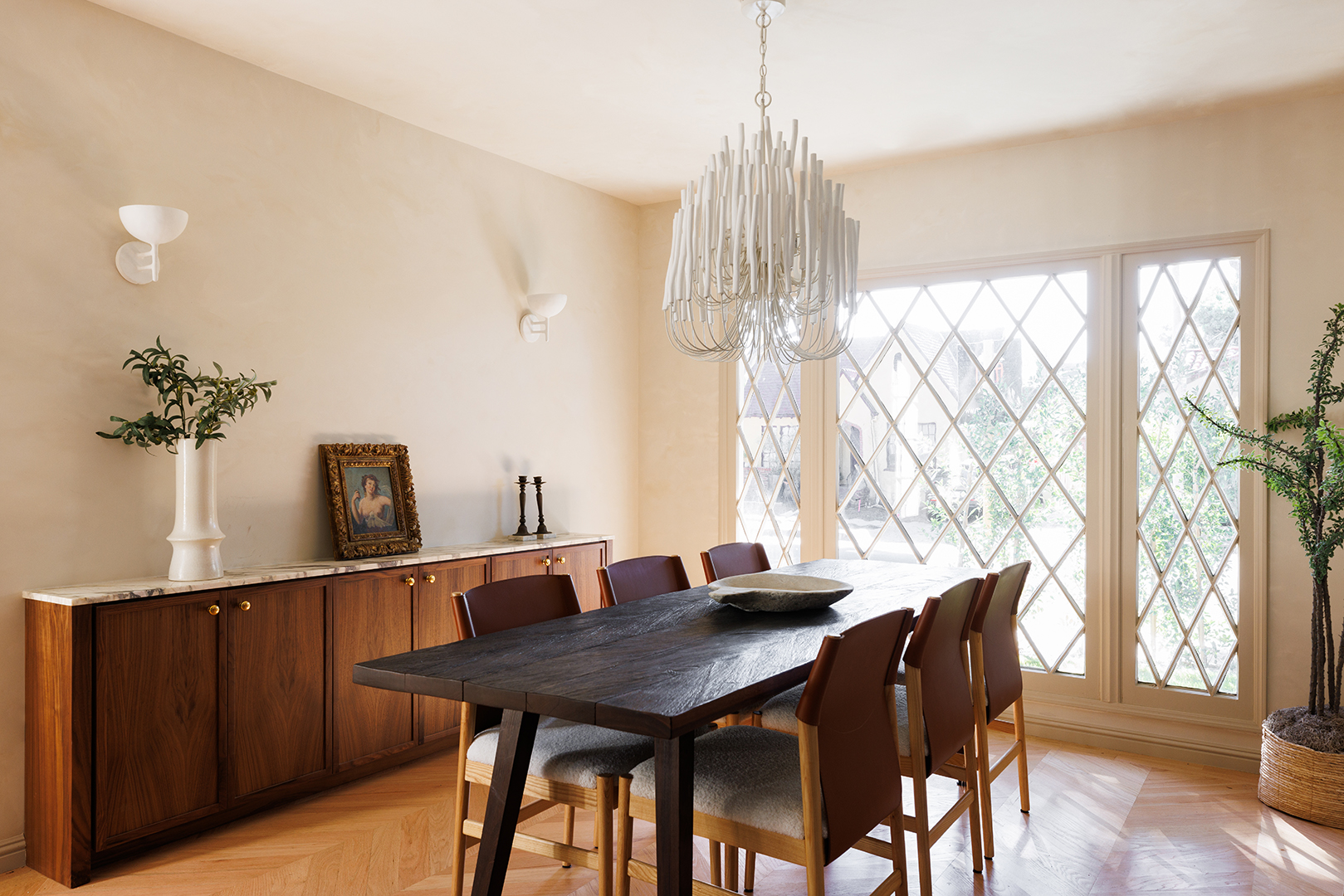 white tiered chandelier over dining table