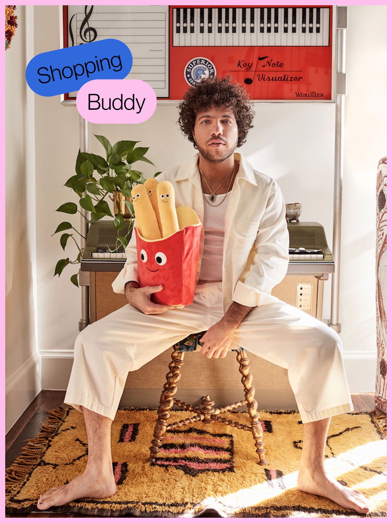 Man holding oversized french fries stuffie