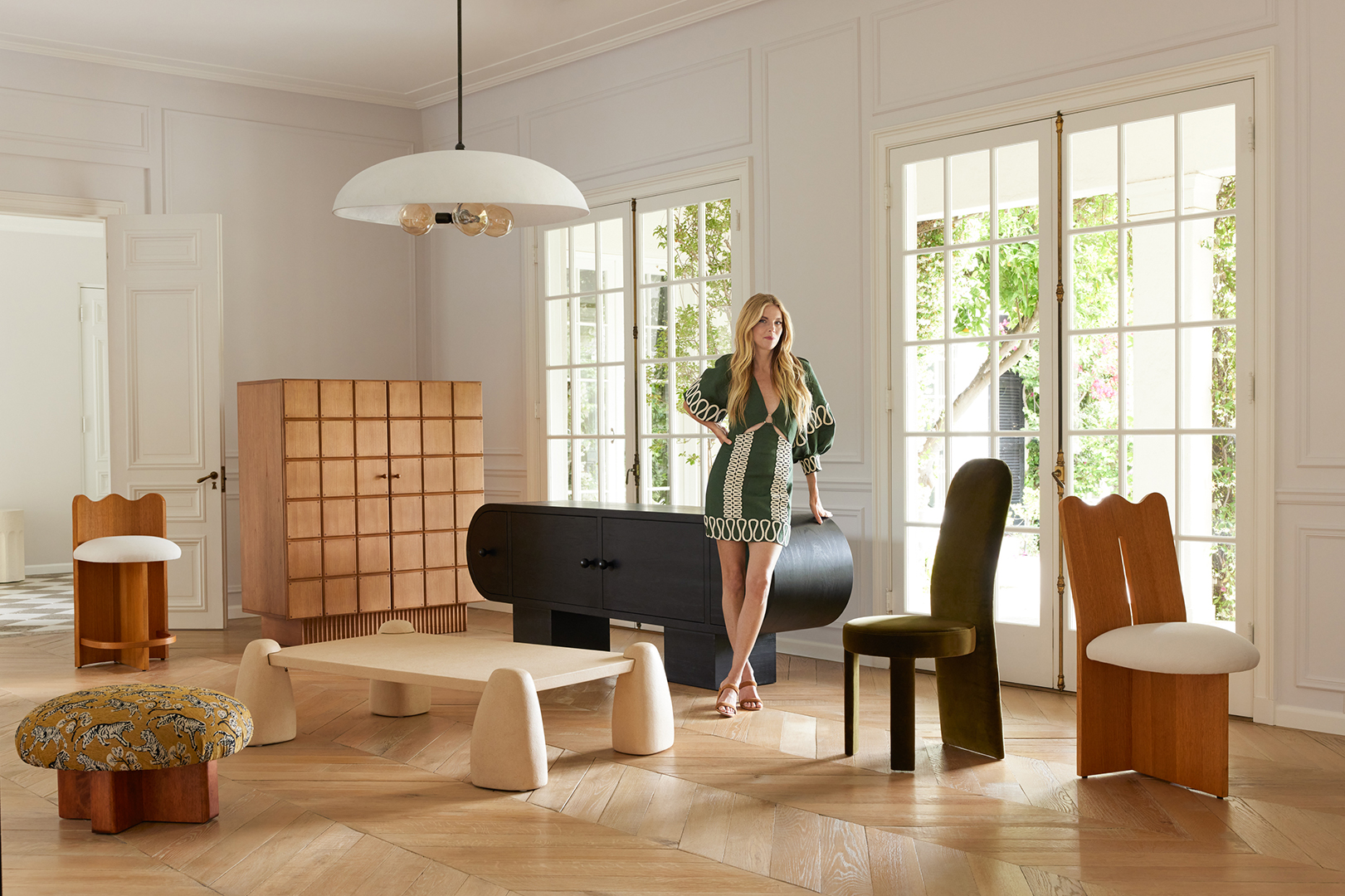 woman standing with chairs