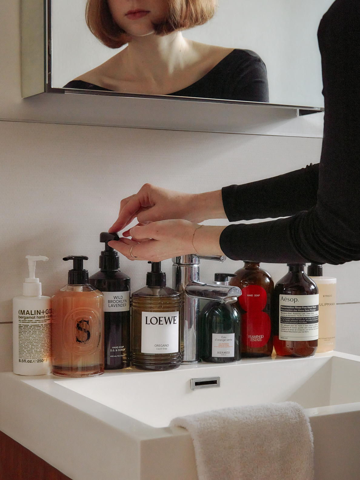 luxury soaps lined up on a bathroom counter