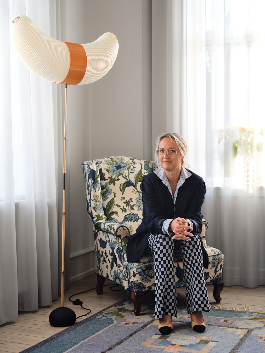 woman in floral chair