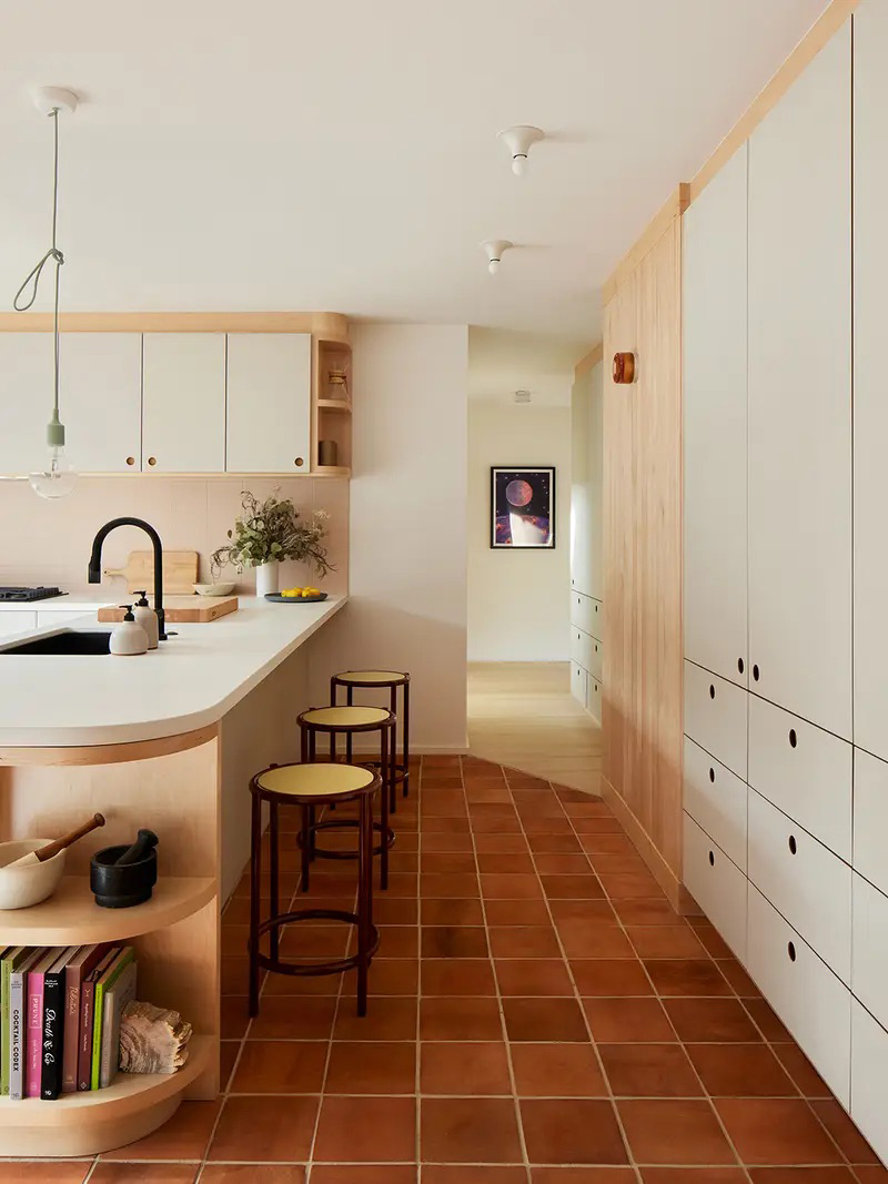 hallway with kitchen cabinets