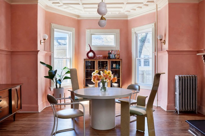 pink dining room with bay window