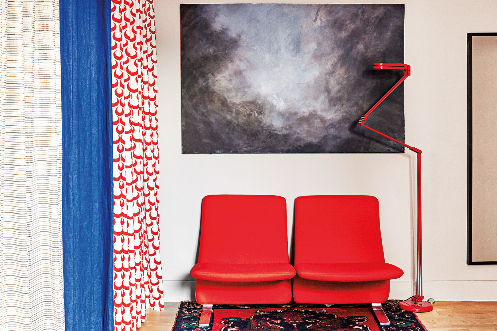 Room with red curtain and red chairs
