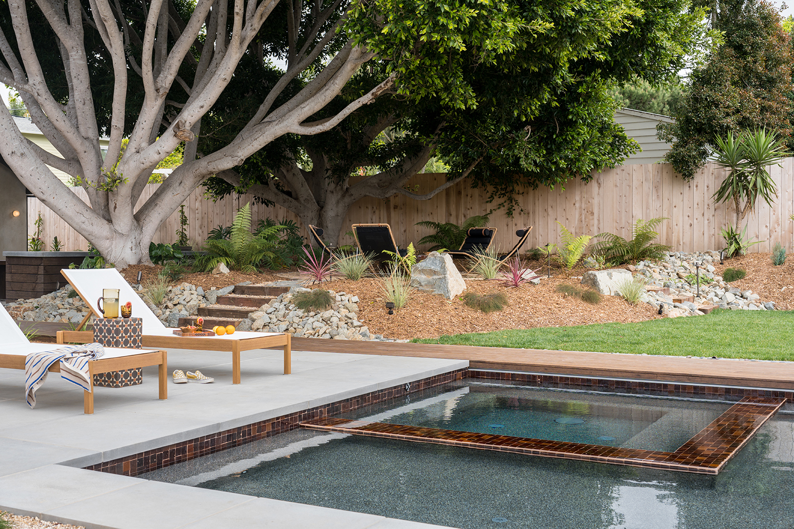 chaises next to pool