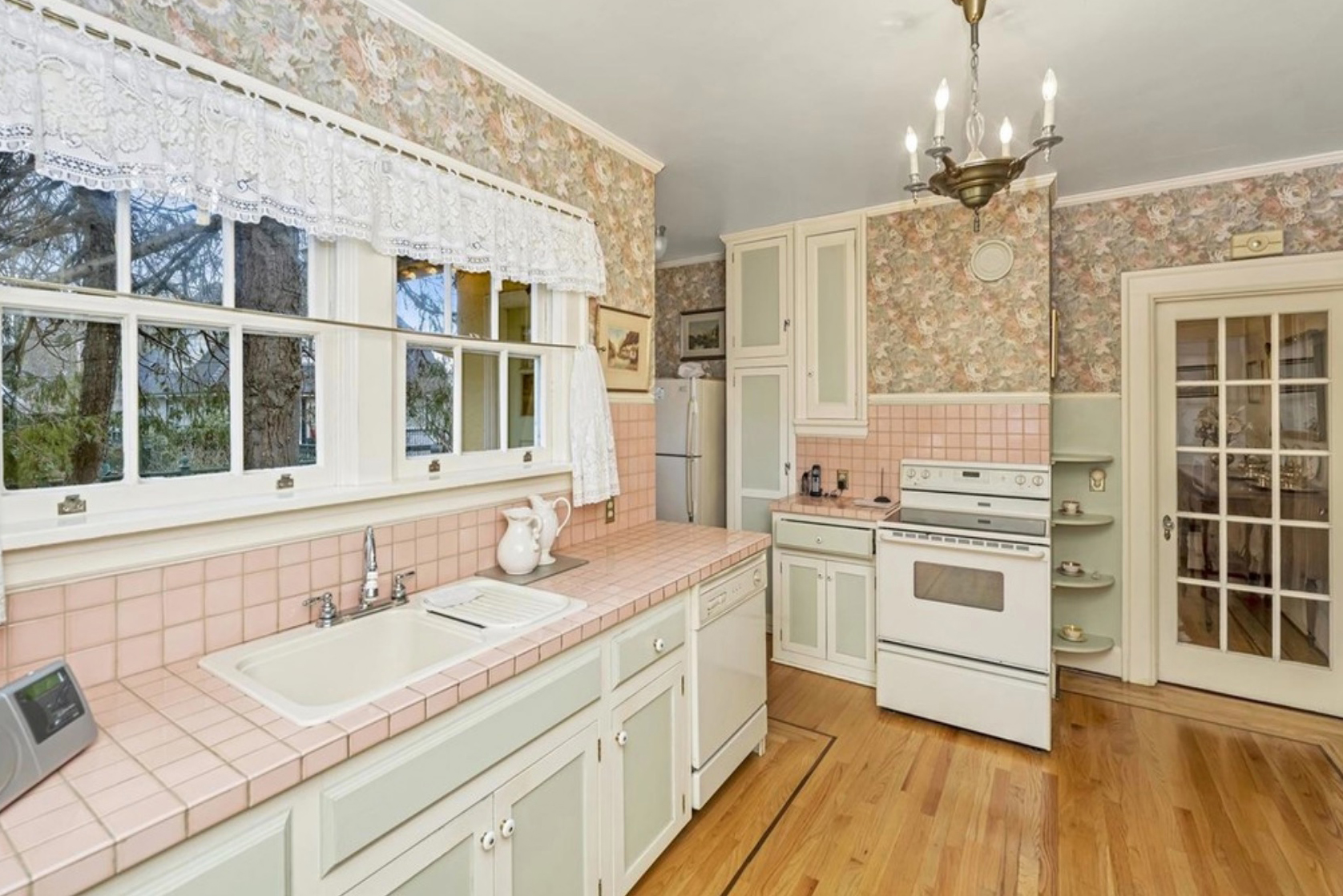 kitchen sink with pink tiled counters