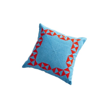  blue throw pillow with red geometric trim
