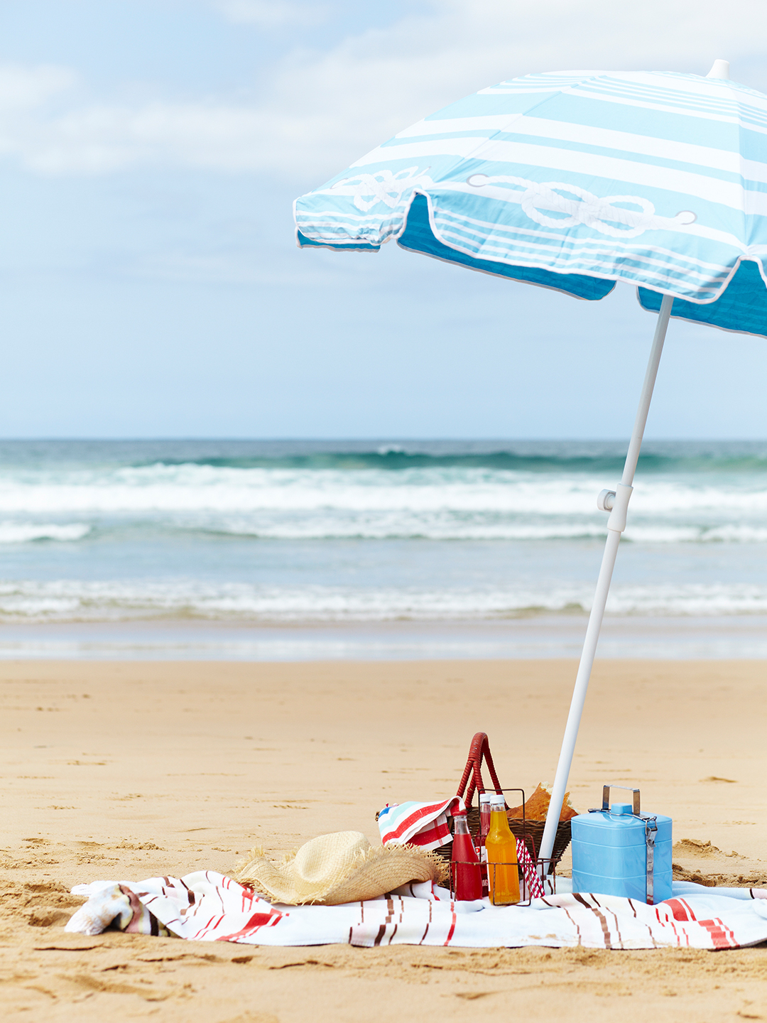 beach set-up with towel and umbrella