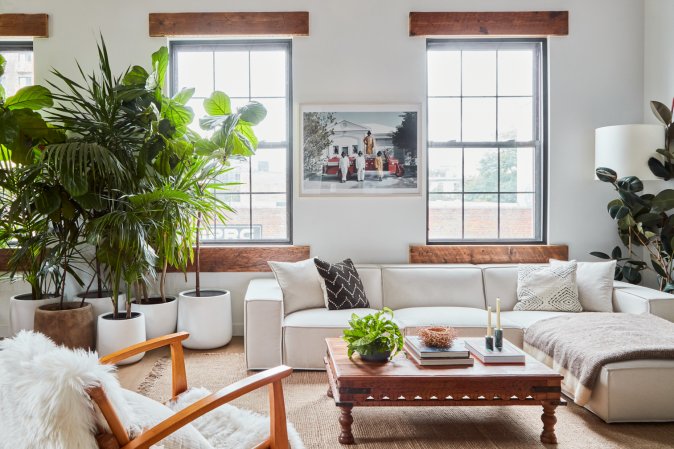 white sectional and brown wood coffee table