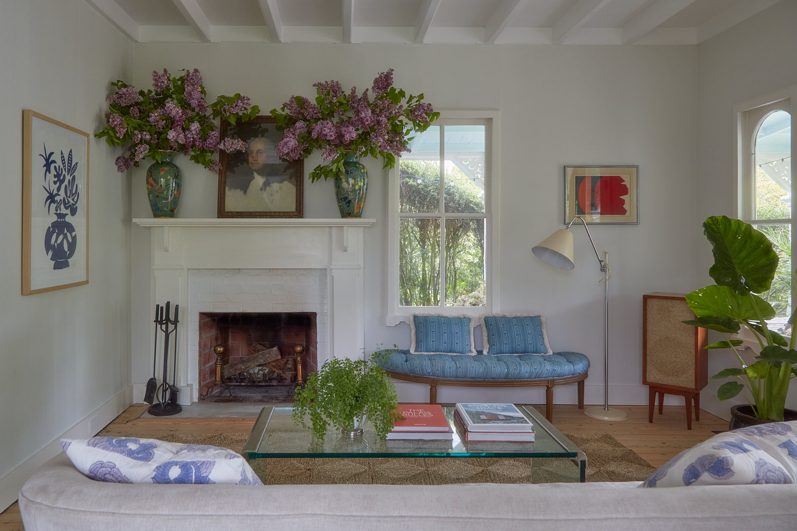 fireplace with flowers on mantel