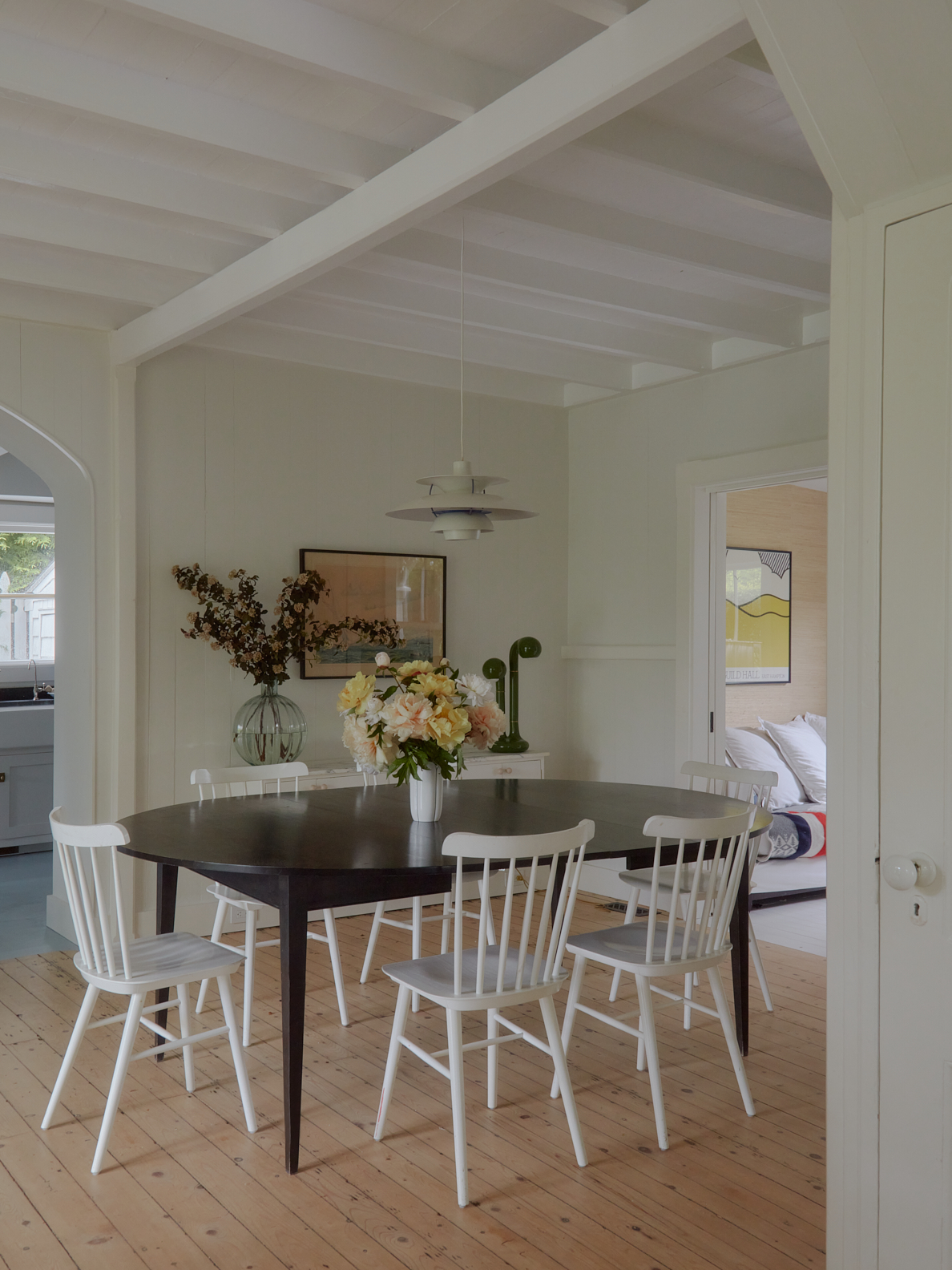 white chairs around black dining table