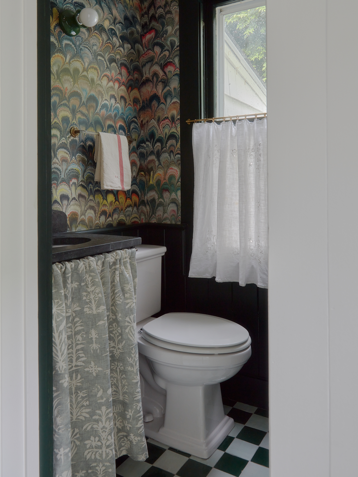 powder bathroom with sink skirt