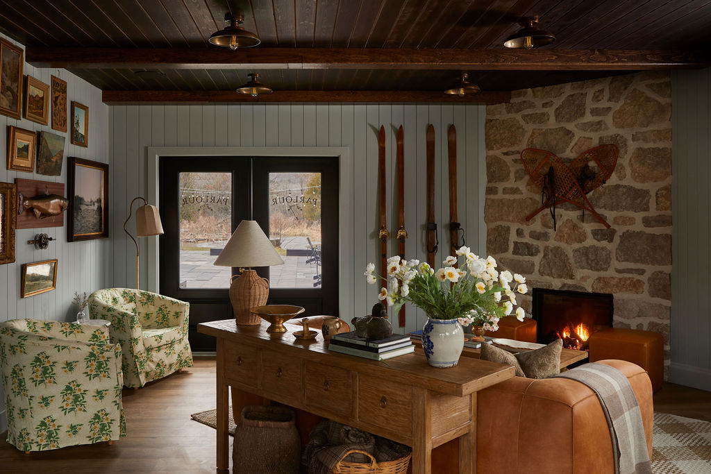 Lobby with paneled blue walls and a fireplace