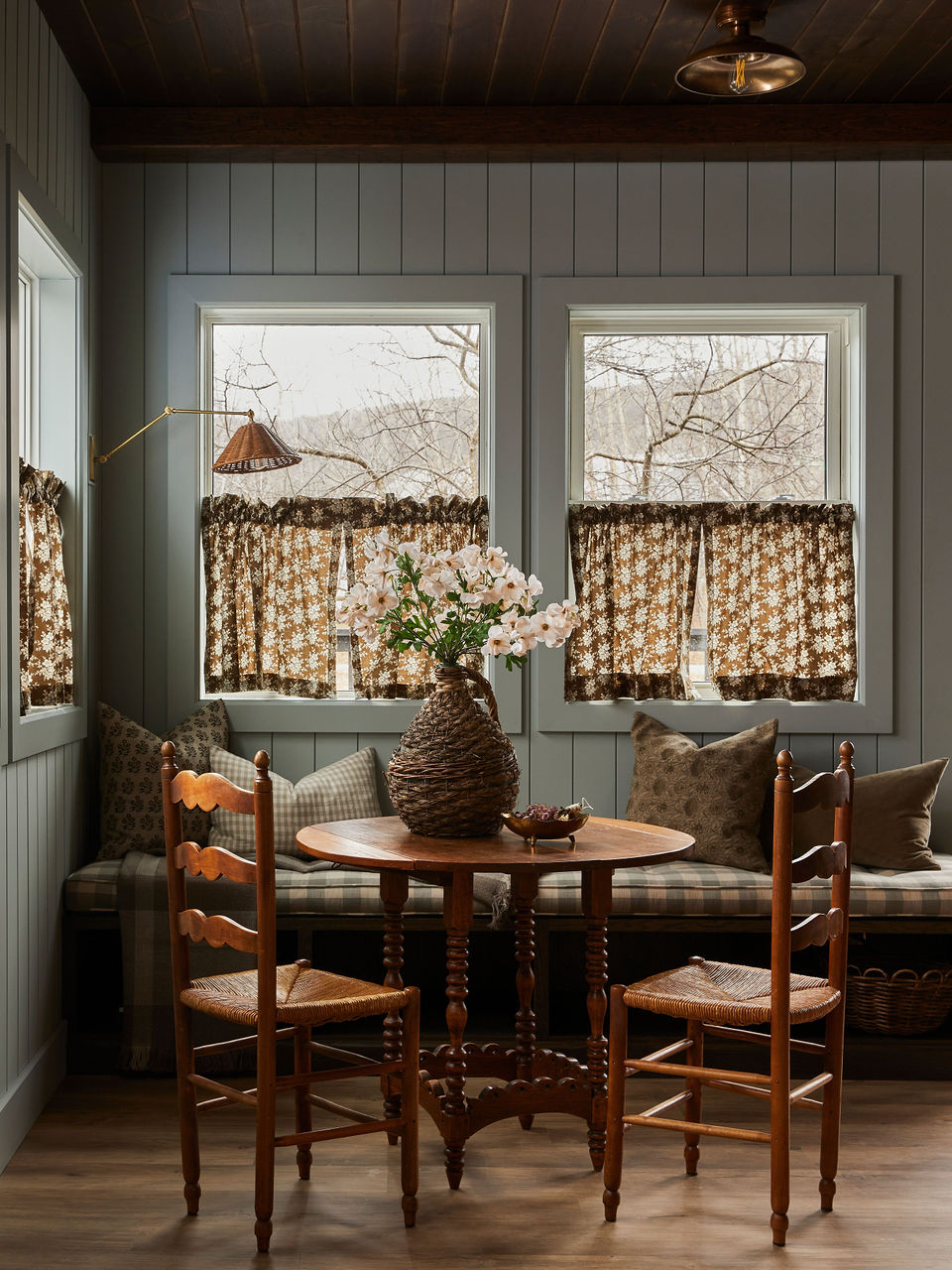 table and chairs in front of window