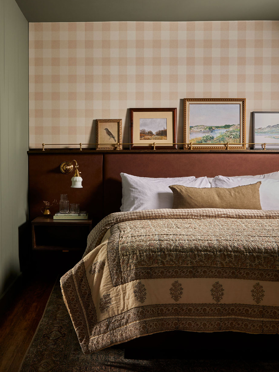 bedroom with gingham wallpaper and built-in headboard