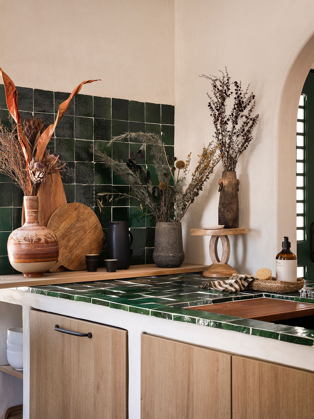 Green tiled kitchen