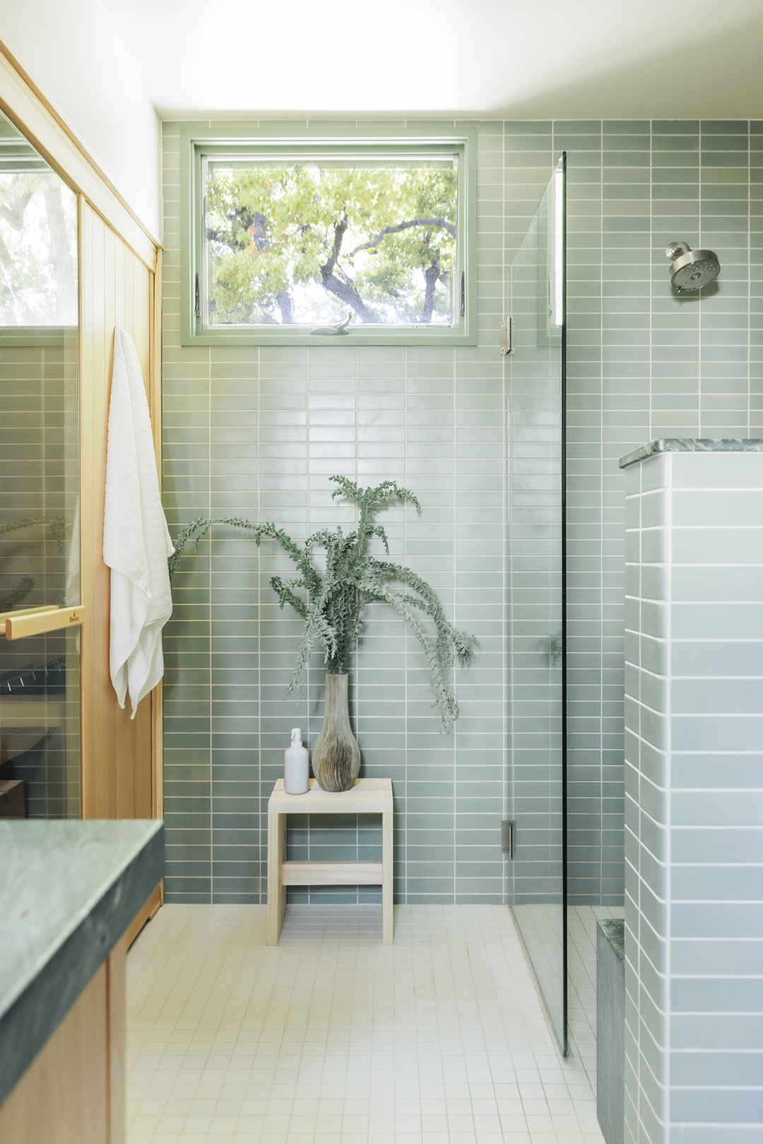 blue tiled bathroom with sauna