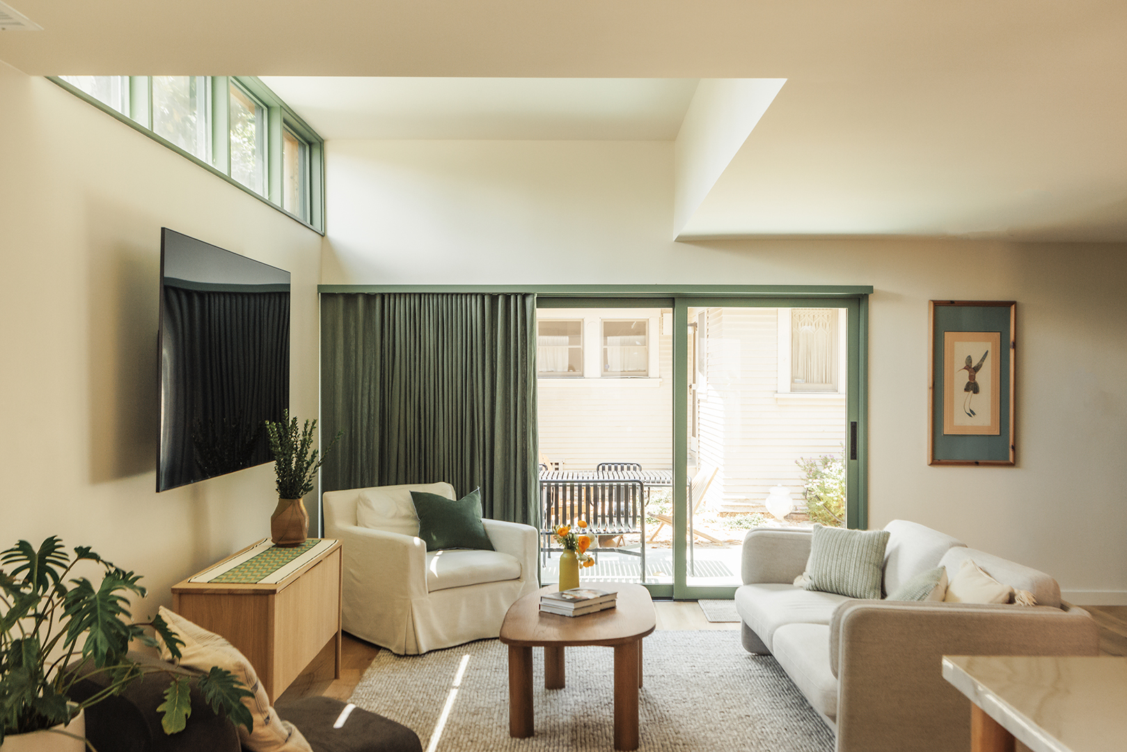 green curtains in white living room