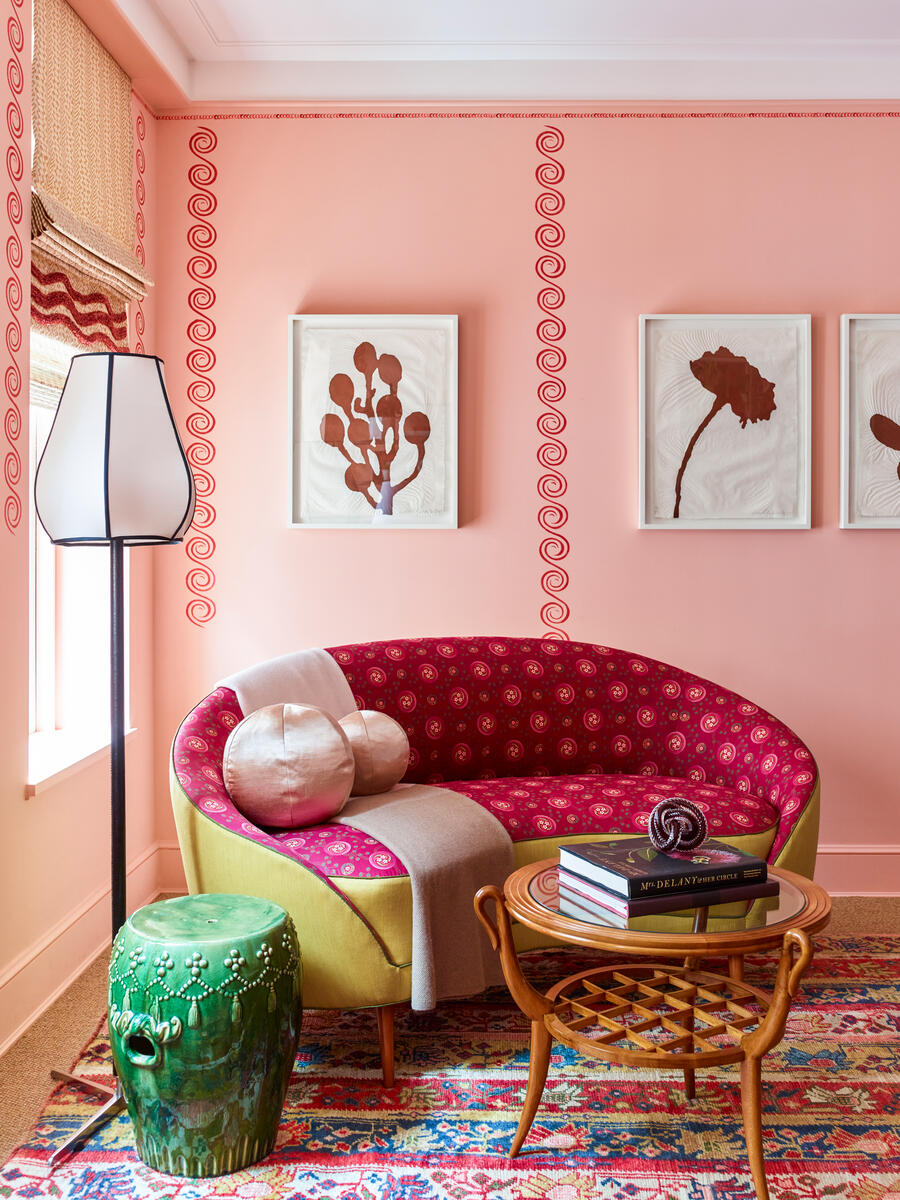 Pink living room with curved sofa