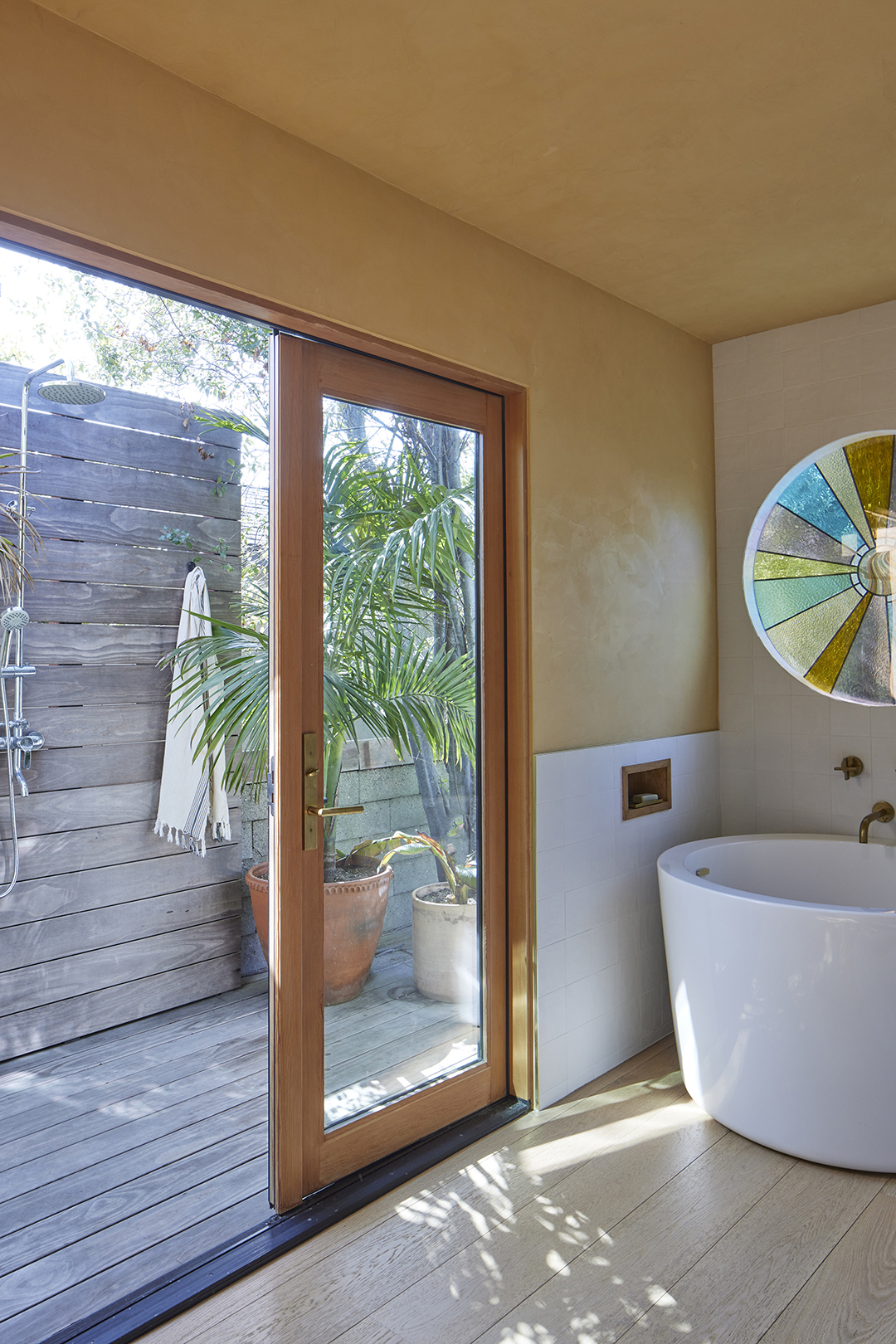 bathroom with indoor-outdoor shower