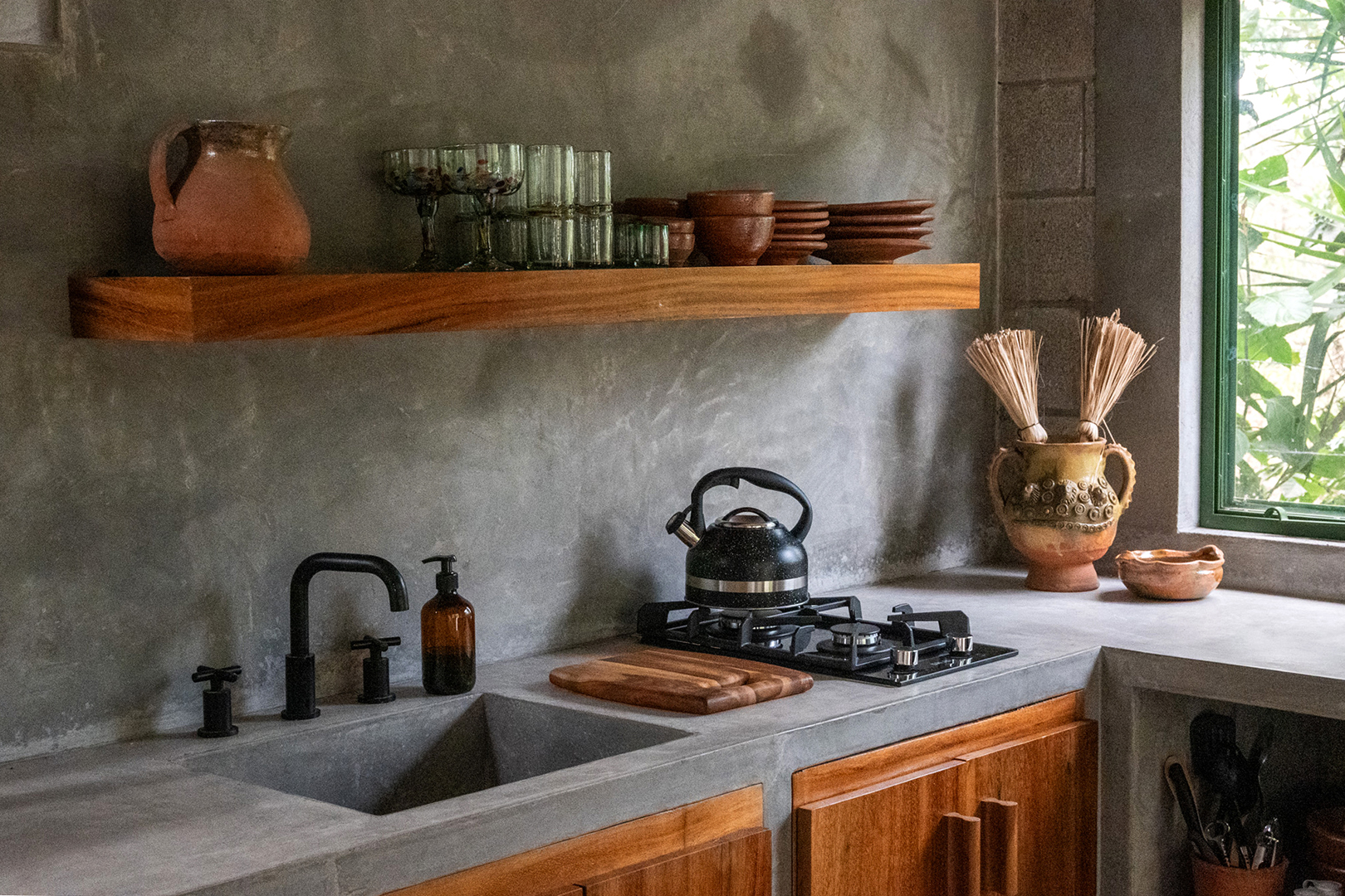 Concrete kitchen with wooden cabinets