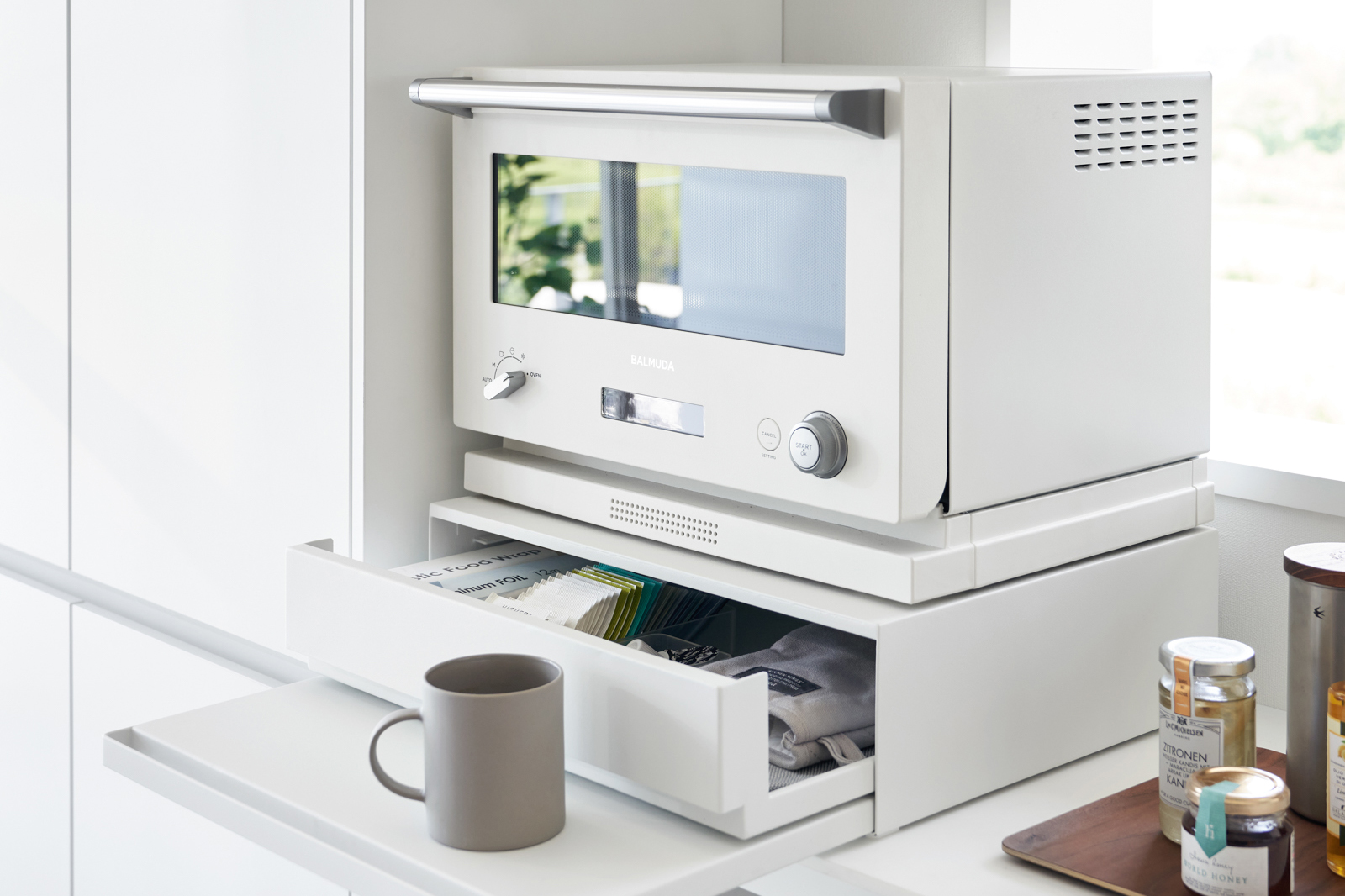 Microwave on top of drawer