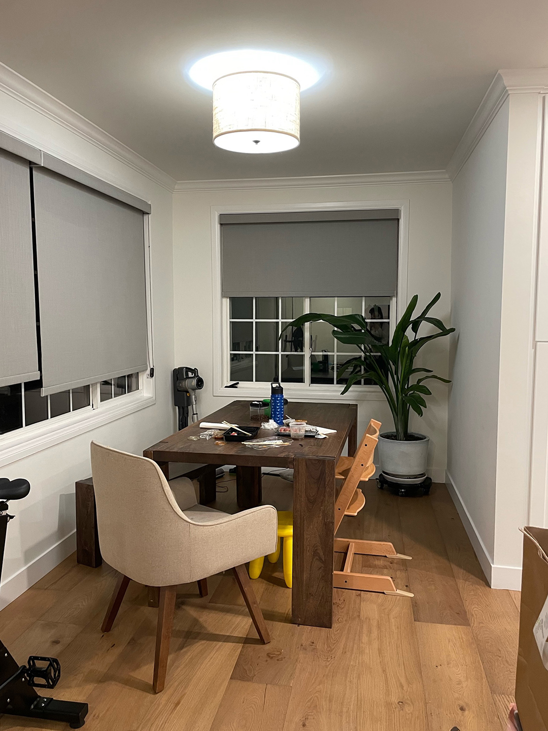 dining area with gray window treatments