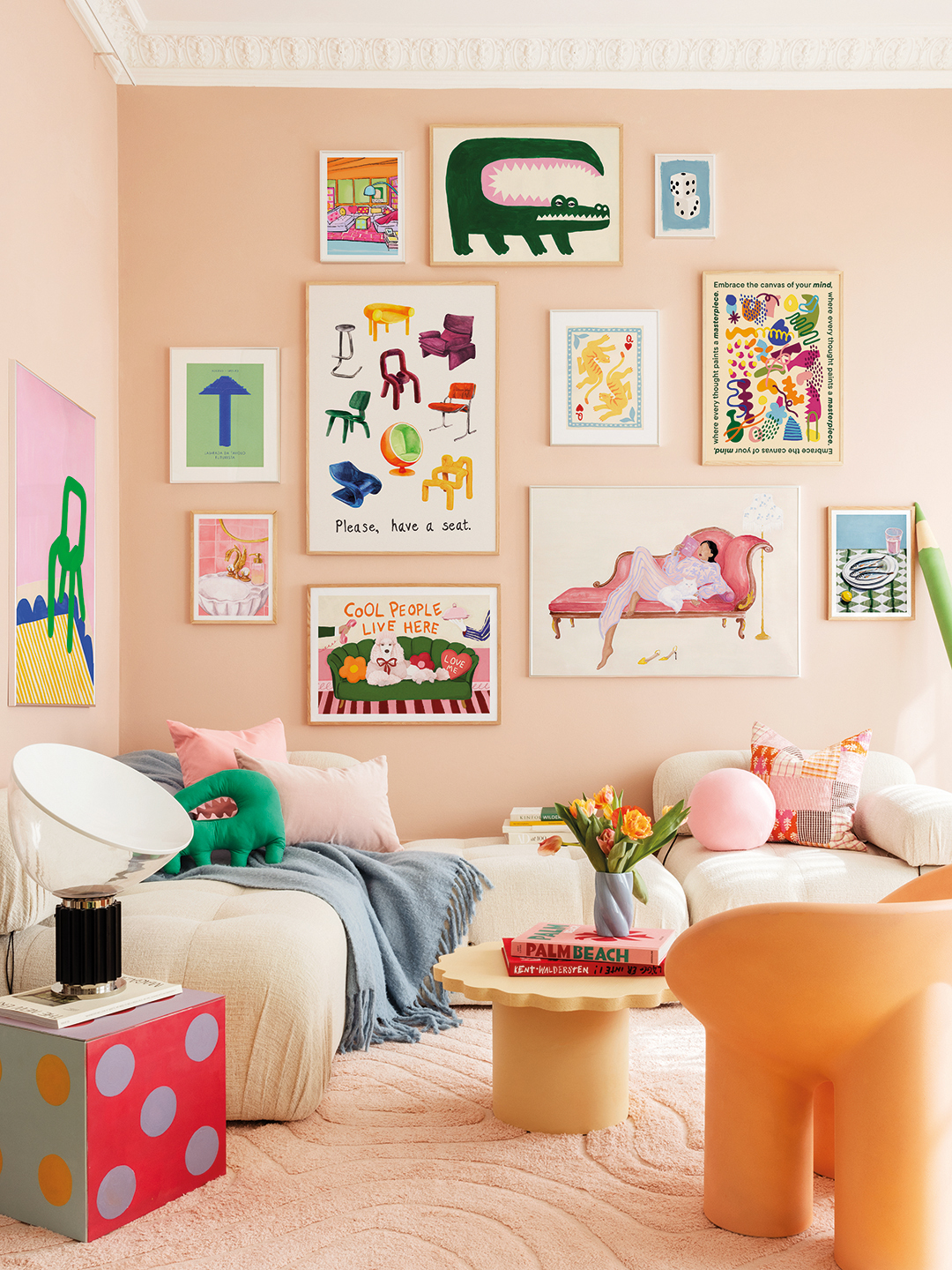 Gallery wall with peach paint