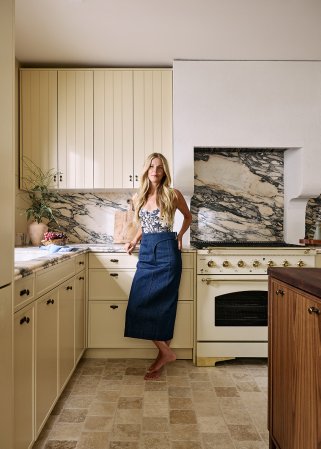 woman leaning against cabinet