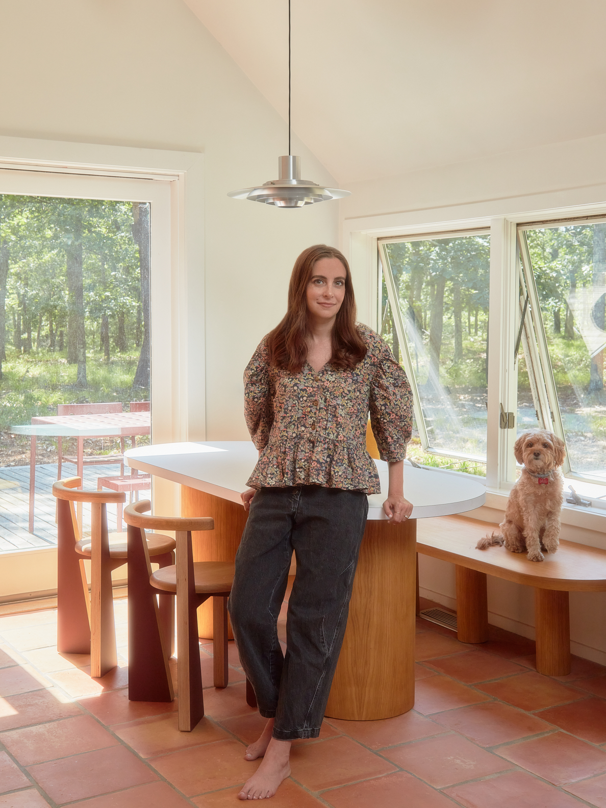 woman leaning on breakfast table