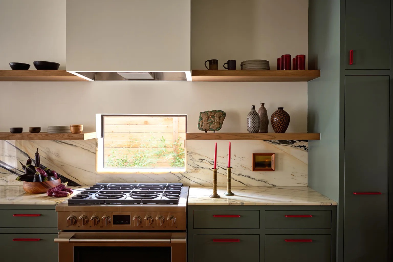 green kitchen with red handles