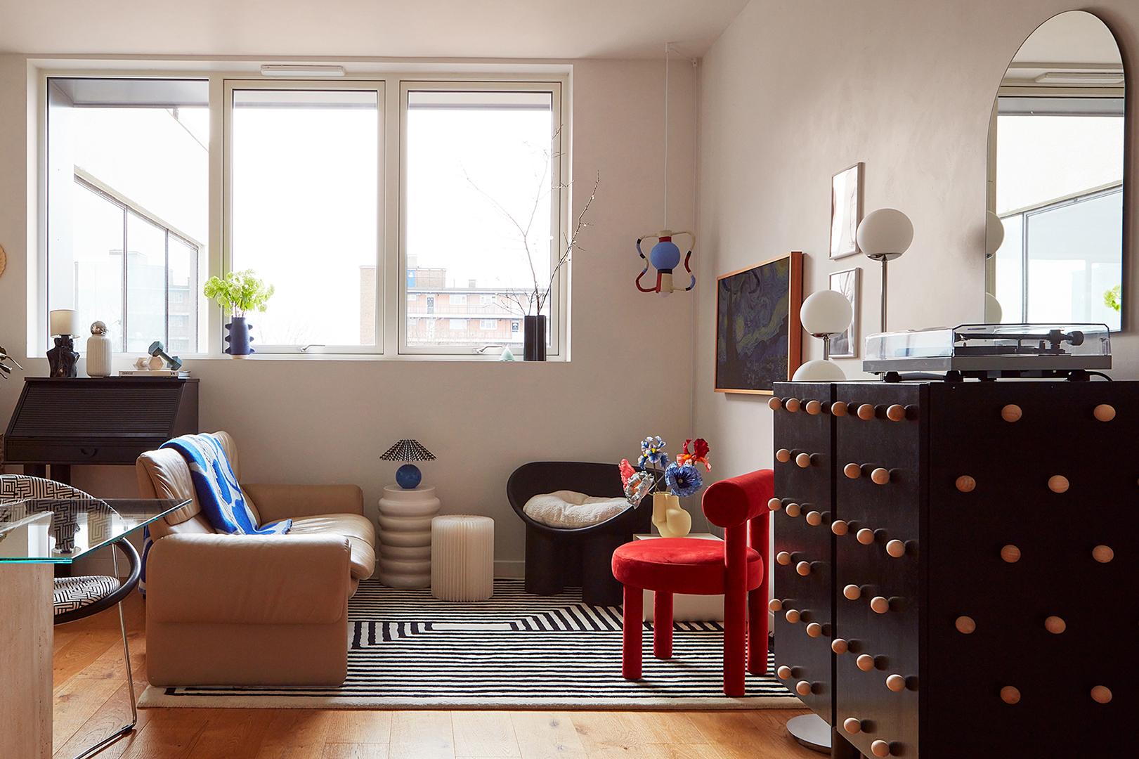 Small living room with red chair