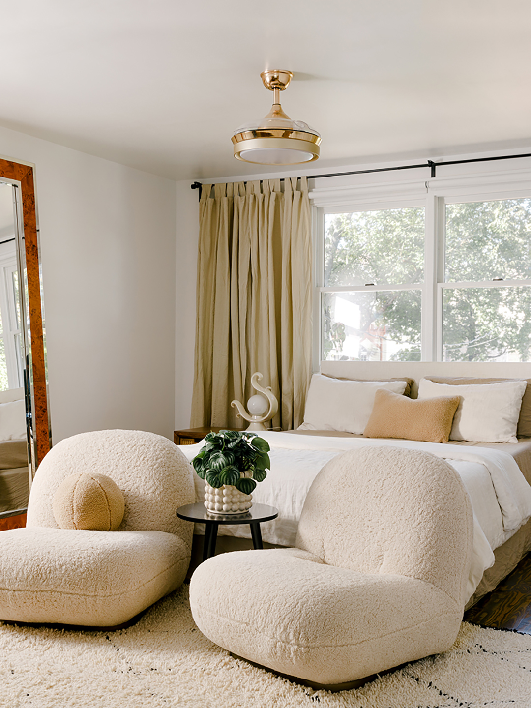 A pair of upholstered chairs in a bedroom