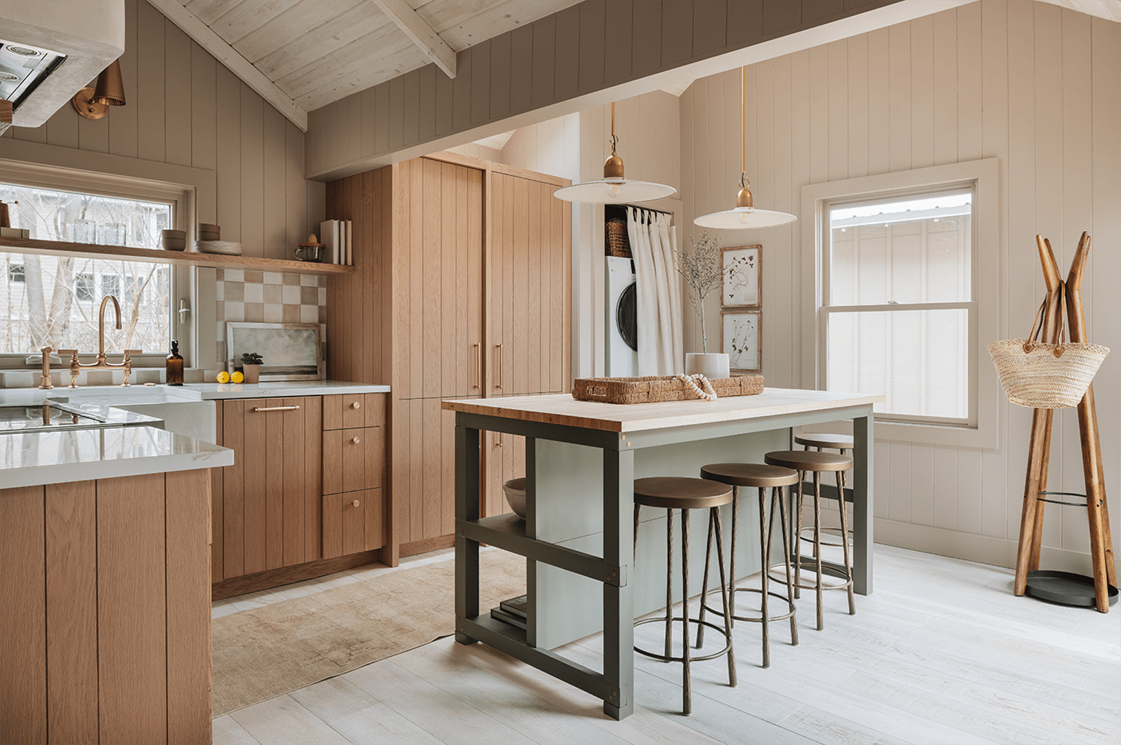 green kitchen island and wood cabinets