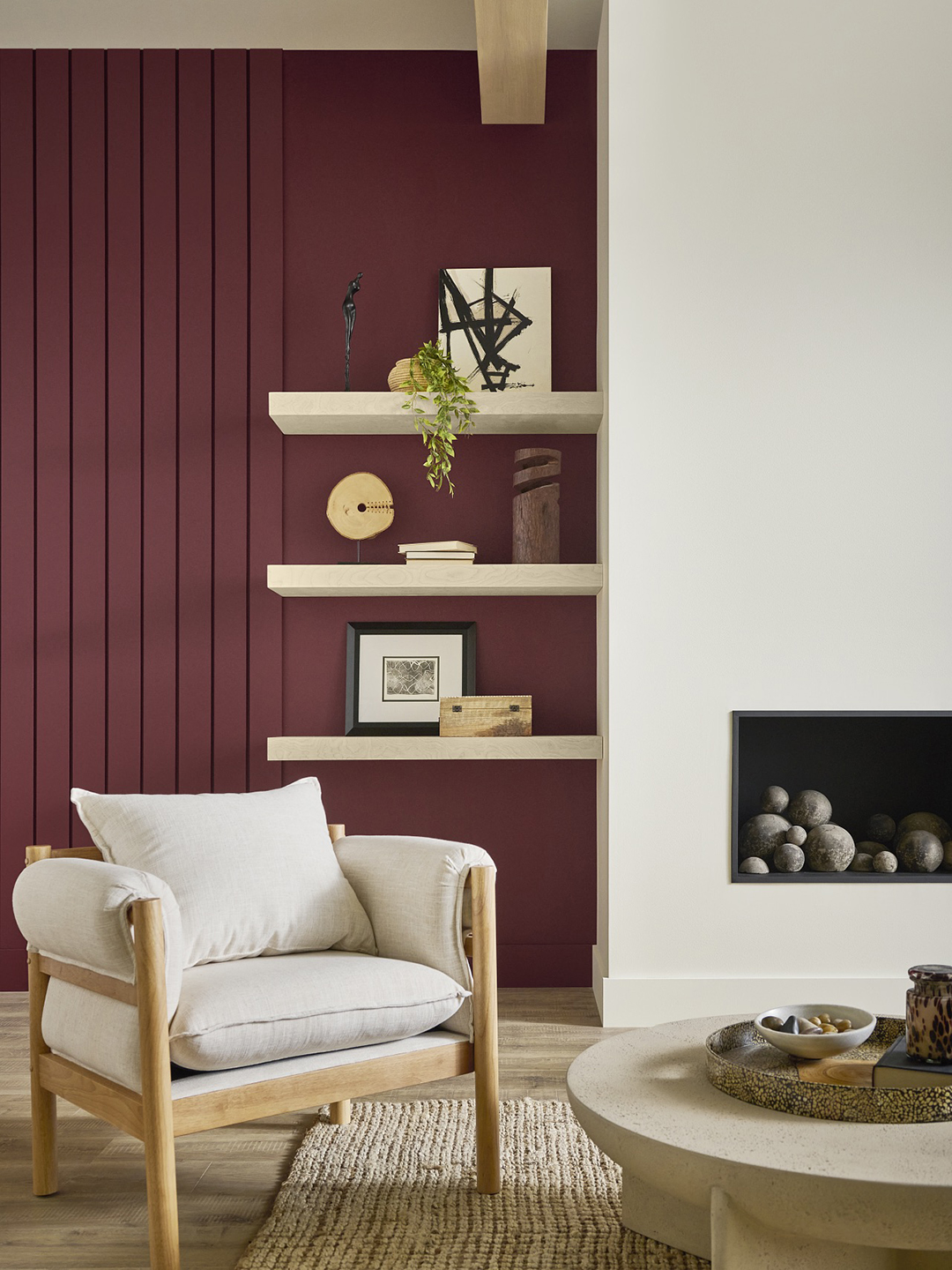 red wall next to white fireplace