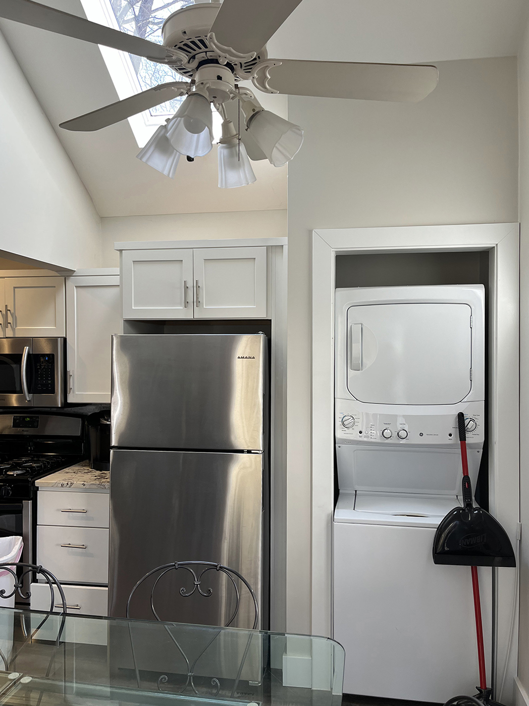 washer-dryer next to kitchen