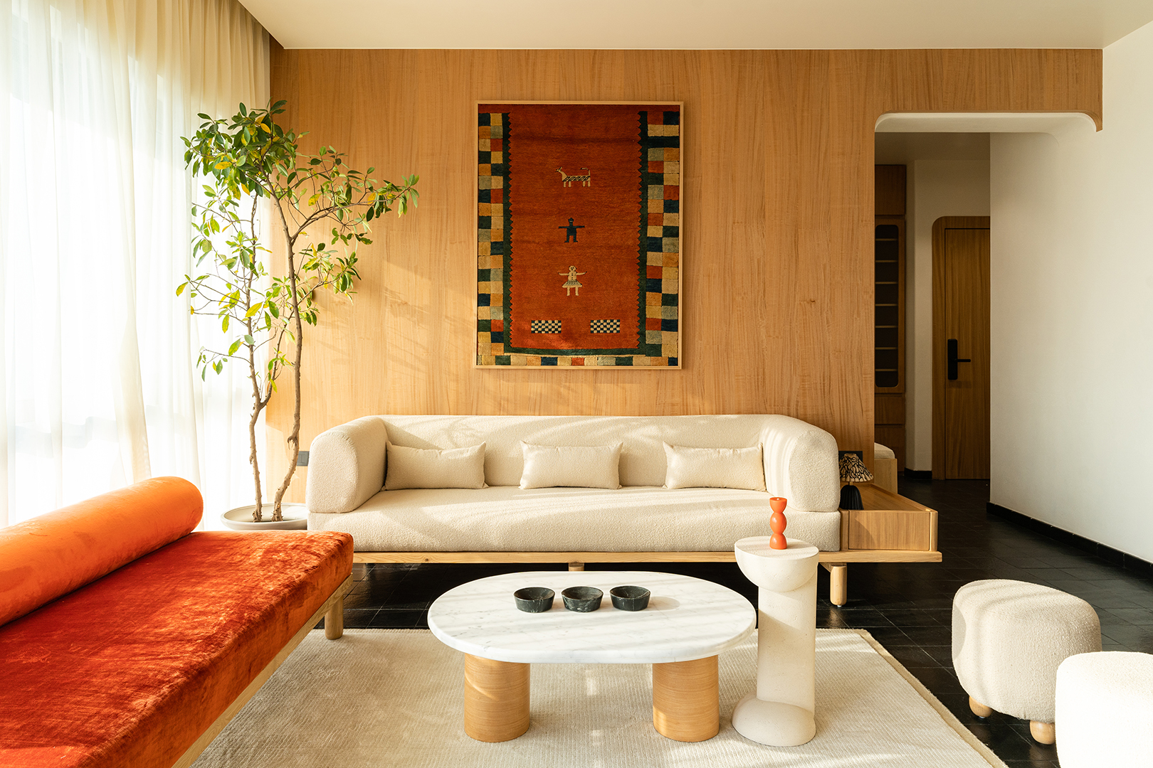 living room with white and orange sofa