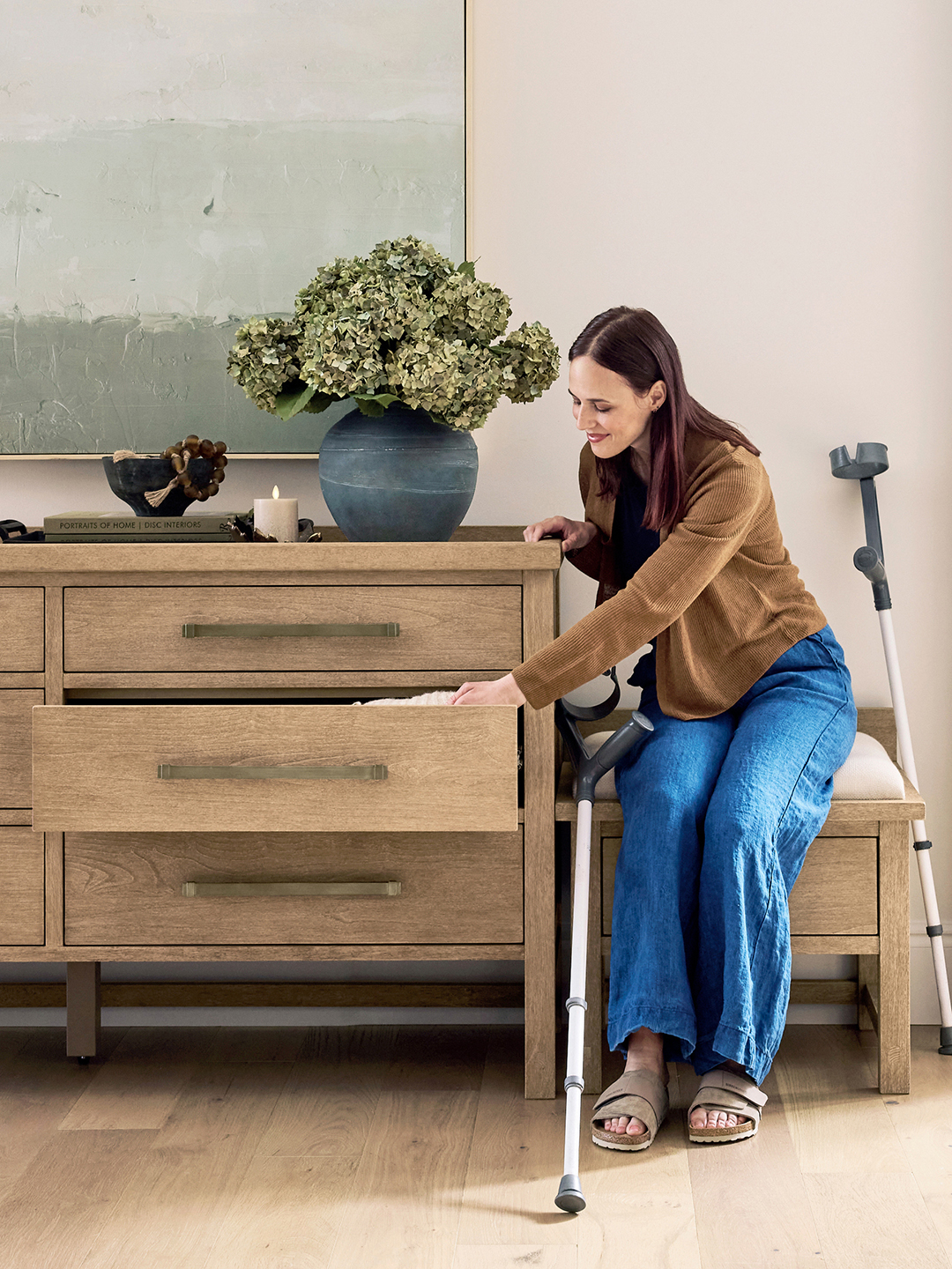 woman looking in dresser