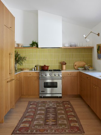 U-shaped kitchen with chartreuse tile backsplash