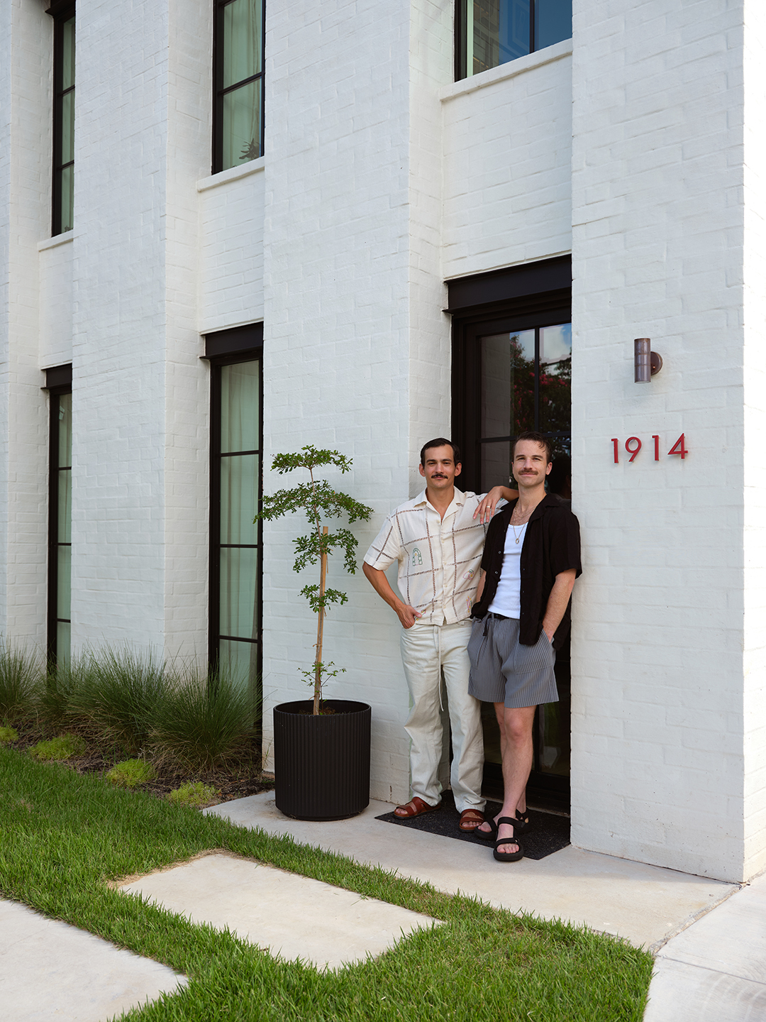 men outside of townhouse