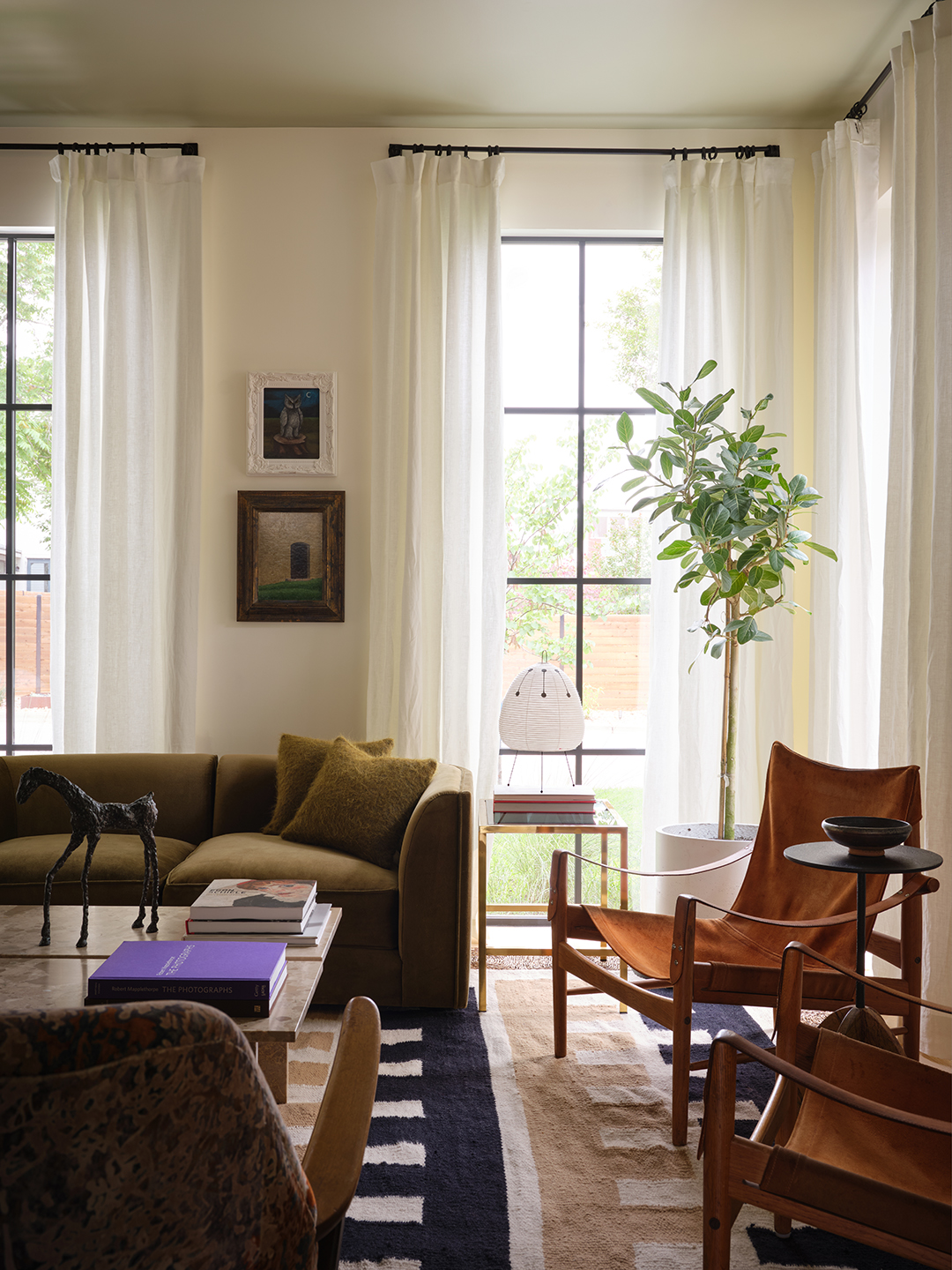 leather sling chairs near windows