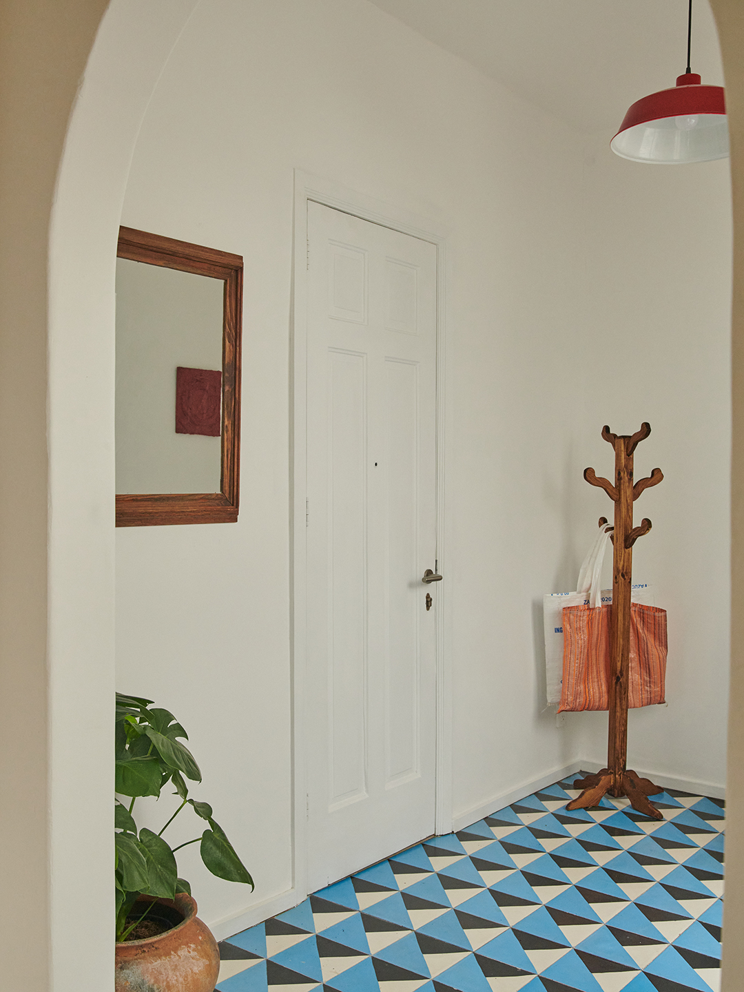 black and blue floor tiles near front door